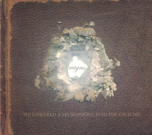 Reigns - We Lowered A Microphone Into The Ground (CD, Album)