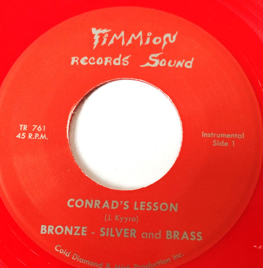 Bronze, Silver & Brass - Conrad's Lesson (7", Single, Red)