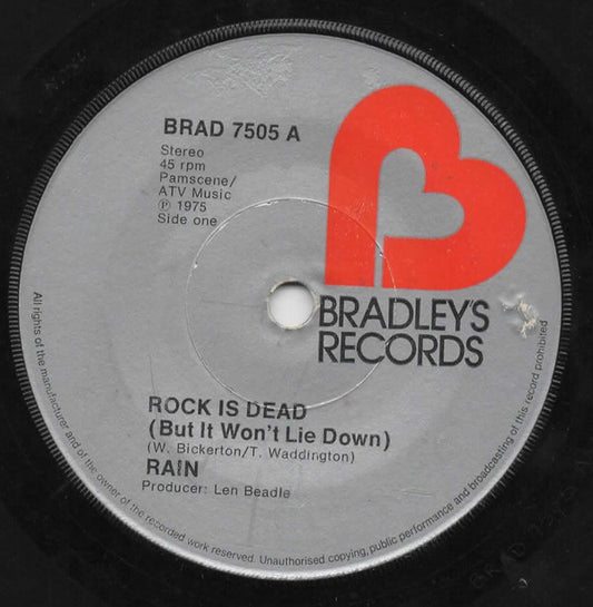 Rain (17) - Rock Is Dead (But It Won't Lie Down) (7")
